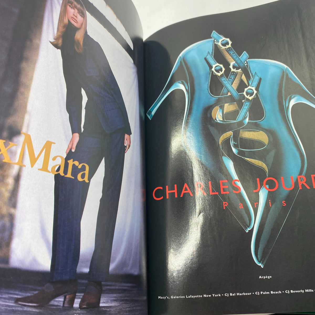 Fashion editorial spread from Vogue Magazine September 1994 showcasing designer Max Mara and a stylish pair of heels by Charles Jourdan, representing early 90s fashion.