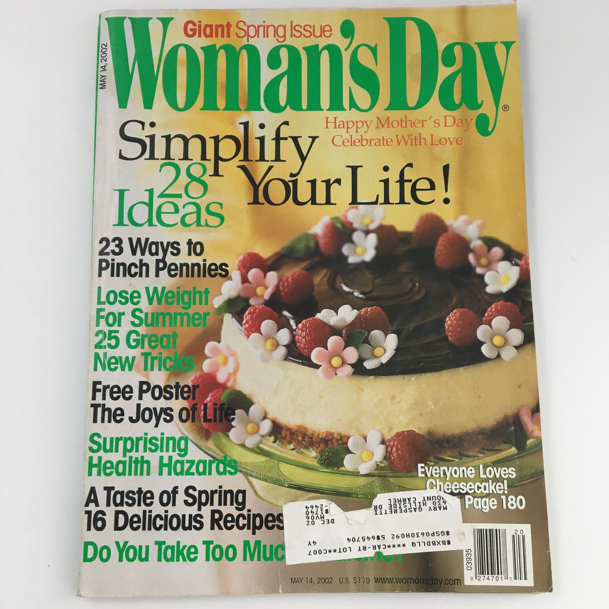 Cover of Woman's Day Magazine May 14 2002 featuring 'Taste of Spring' with 16 delicious recipes, showcasing a vibrant cake with flowers and a festive spring theme.