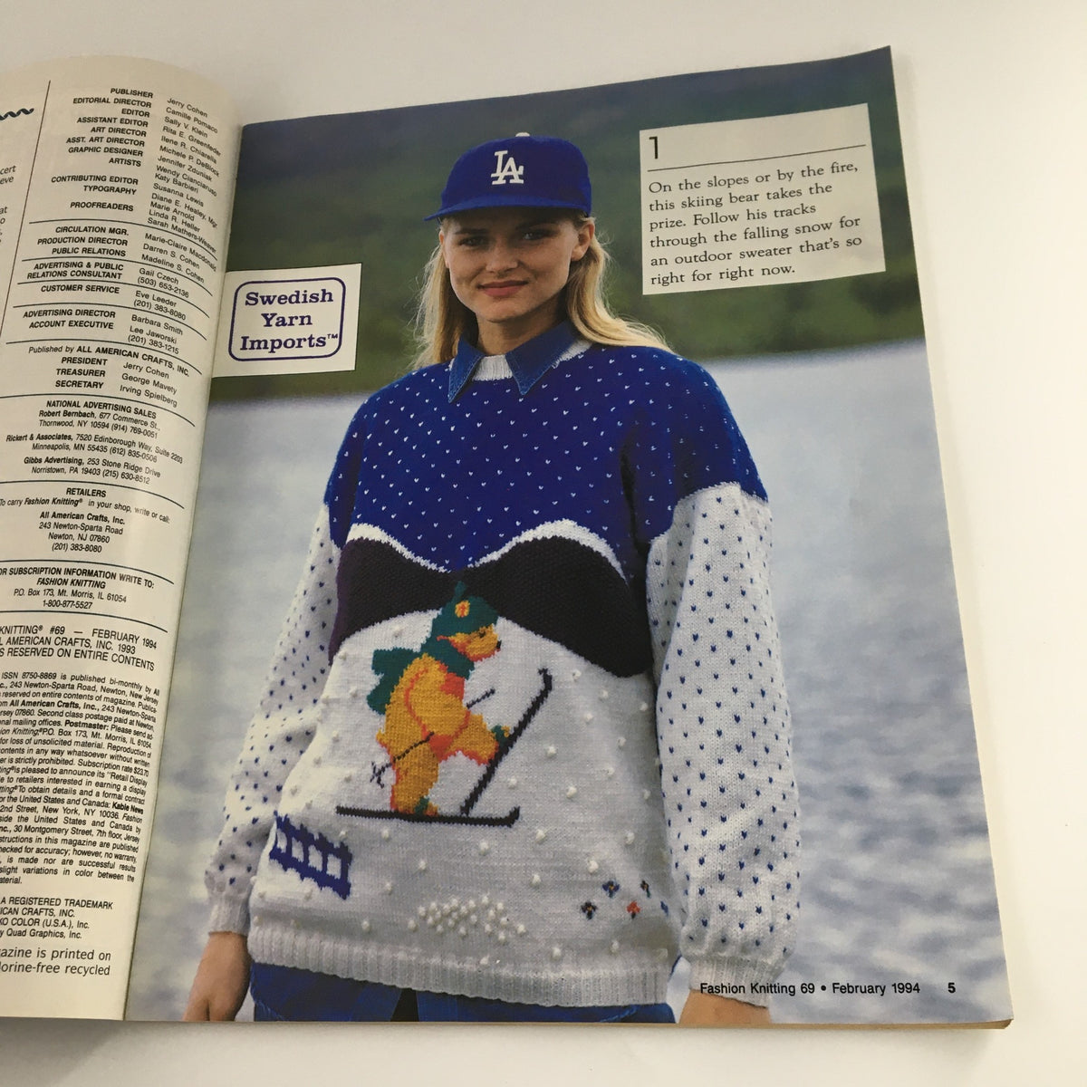 Interior page from Fashion Knitting Magazine February 1994 #69 displaying a knitted sweater design with a skiing bear motif, highlighting winter fashion.