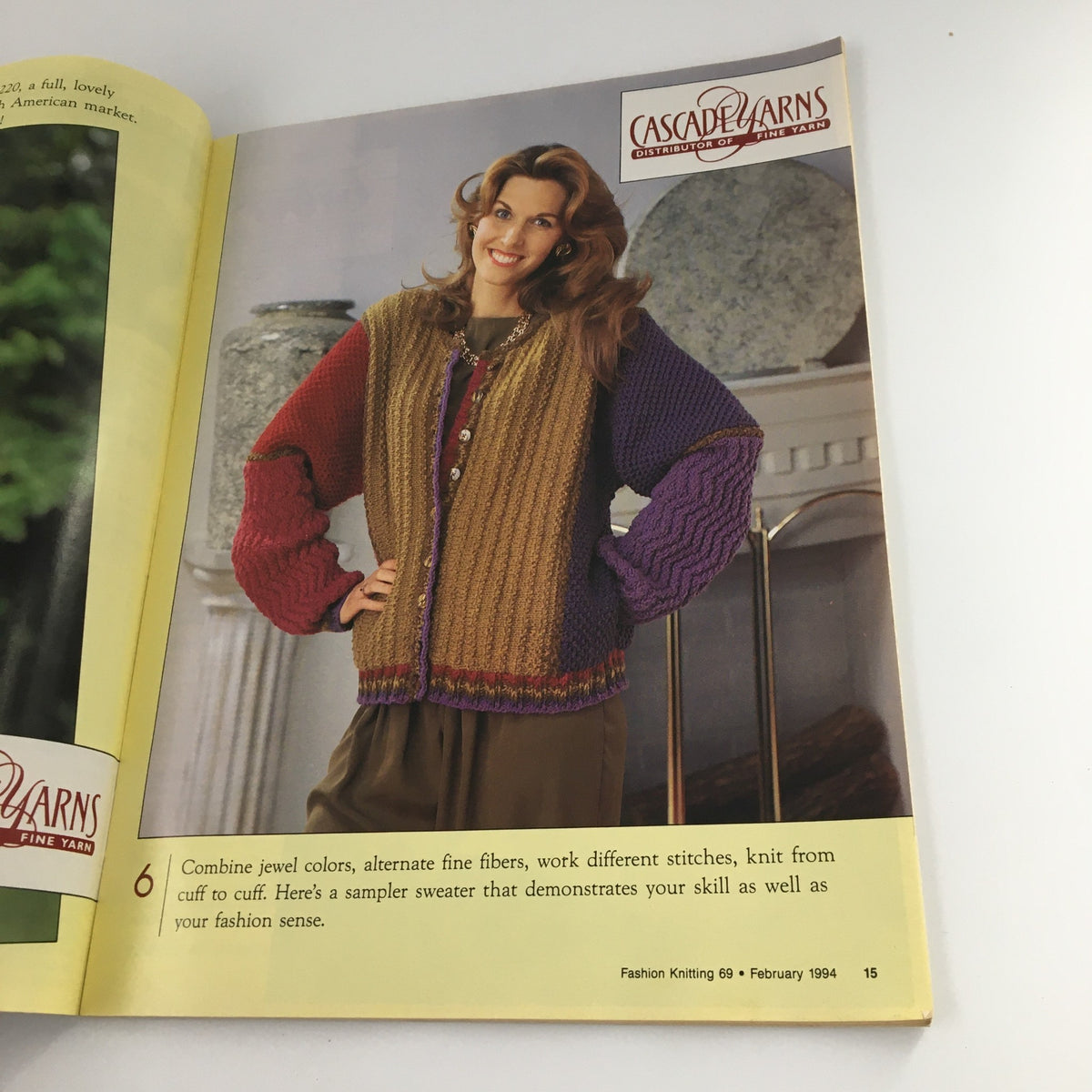 Fashion Knitting Magazine February 1994 #69 page featuring a model wearing a colorful knitted sweater, demonstrating unique pattern and color combinations for knitwear.