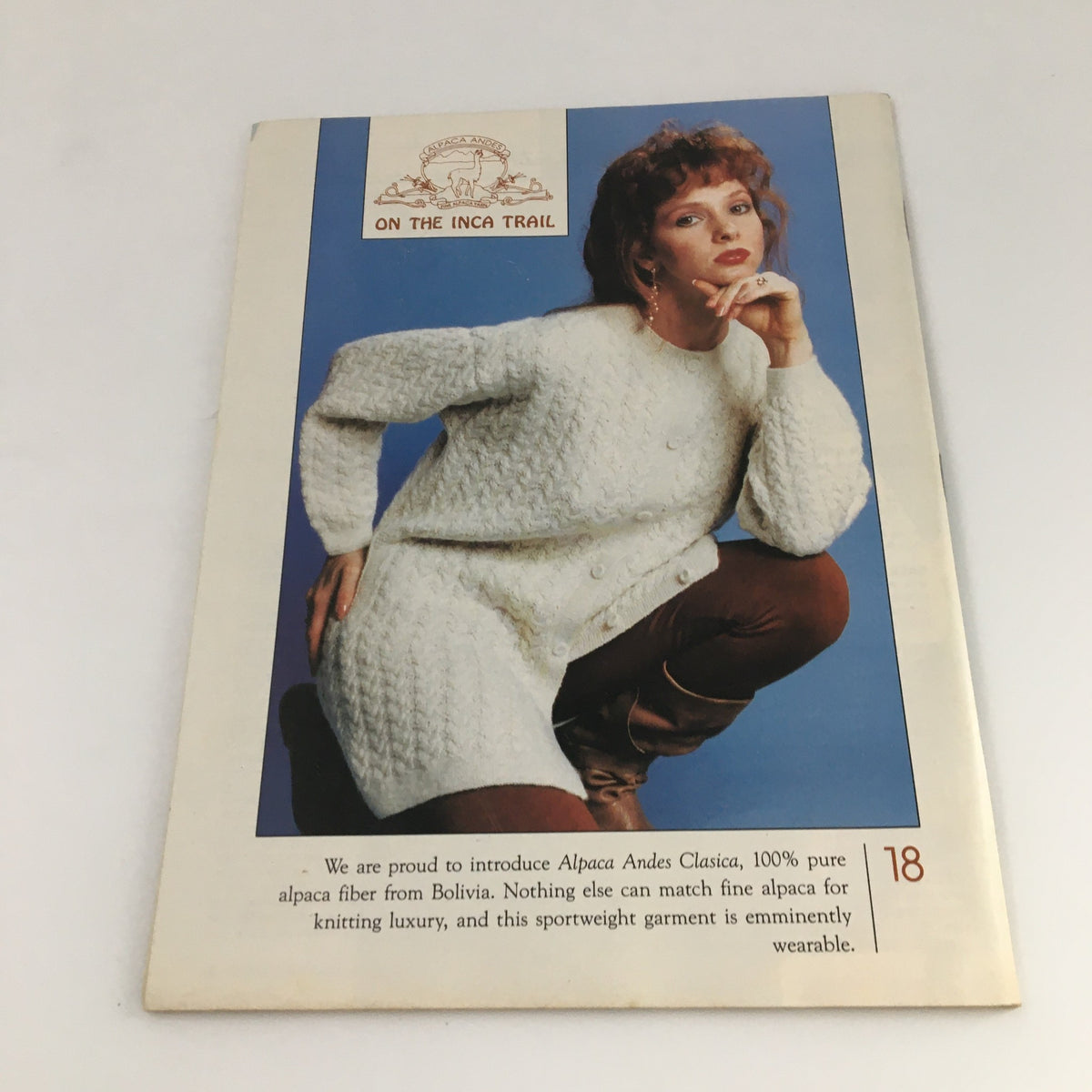 Cover image from Fashion Knitting Magazine February 1994 #69 displaying a model in a chic white alpaca sweater, emphasizing the luxury of alpaca fiber from Bolivia. This vintage magazine includes insights into knitting fashion trends and patterns of the early 90s.