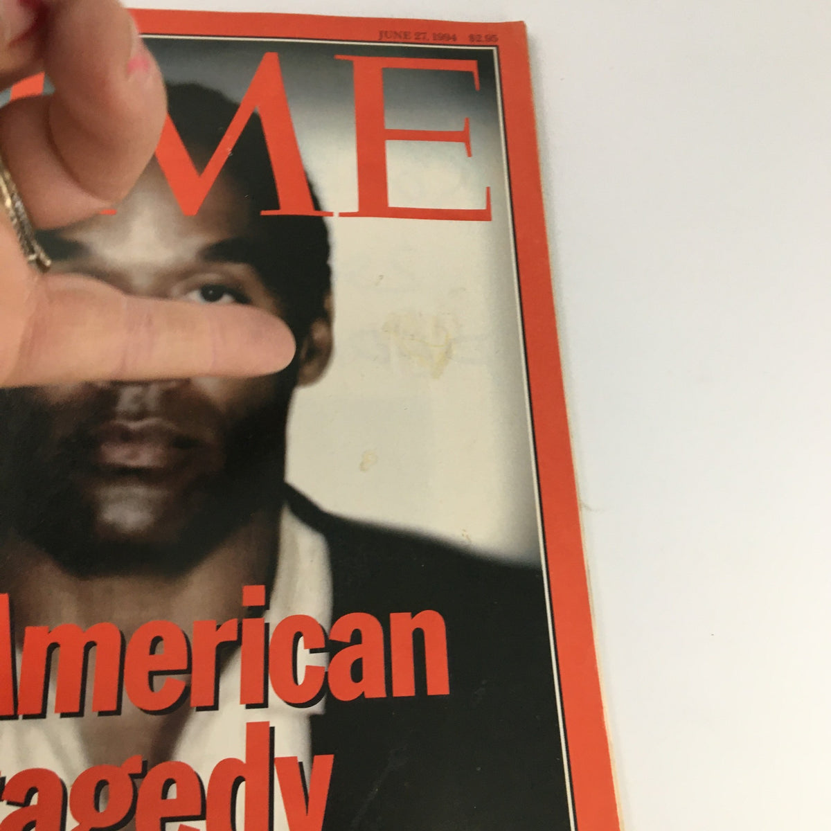 Close-up view of the Time Magazine cover from June 27 1994, highlighting O.J. Simpson's image and the title 'An American Tragedy'.