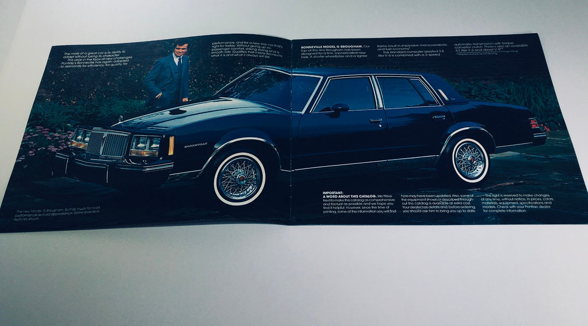Inside view of the 1982 Pontiac Bonneville Model G Brougham 4-Door Sedan Car Sales Brochure showing a man beside the car and detailed description of features.
