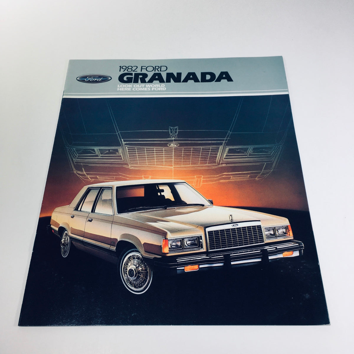 1982 Ford Granada GLX Series car sales brochure cover featuring a golden Ford Granada against a dramatic background.