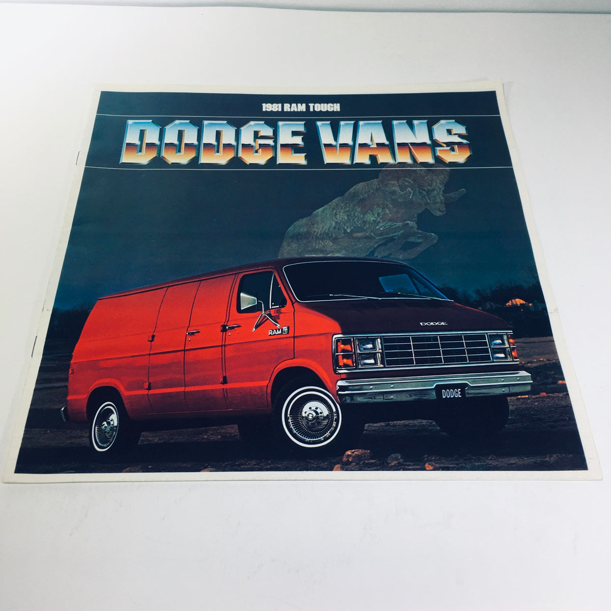 1981 Ram Tough Dodge Truck Vans B150 B250 B350 V-8 Power Car Sale Brochure cover featuring a red Dodge van against a dramatic background.