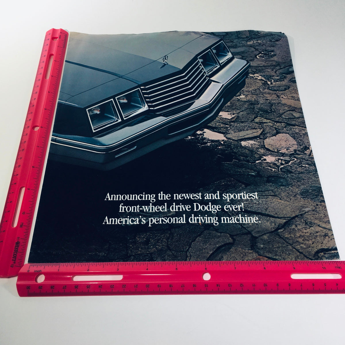 1982 Dodge 400 in Charcoal Silver Vinyl Roof Personal Luxury Car Sale Brochure showcasing the car's front view with text promoting it as America's personal driving machine.