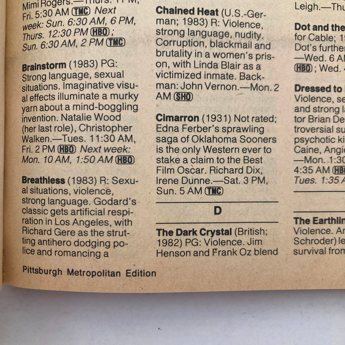 Interior page of TV Guide Magazine April 13 1985, listing shows such as 'Brainstorm' and 'The Dark Crystal', illustrating the Pittsburgh Metro Edition and various movie summaries.