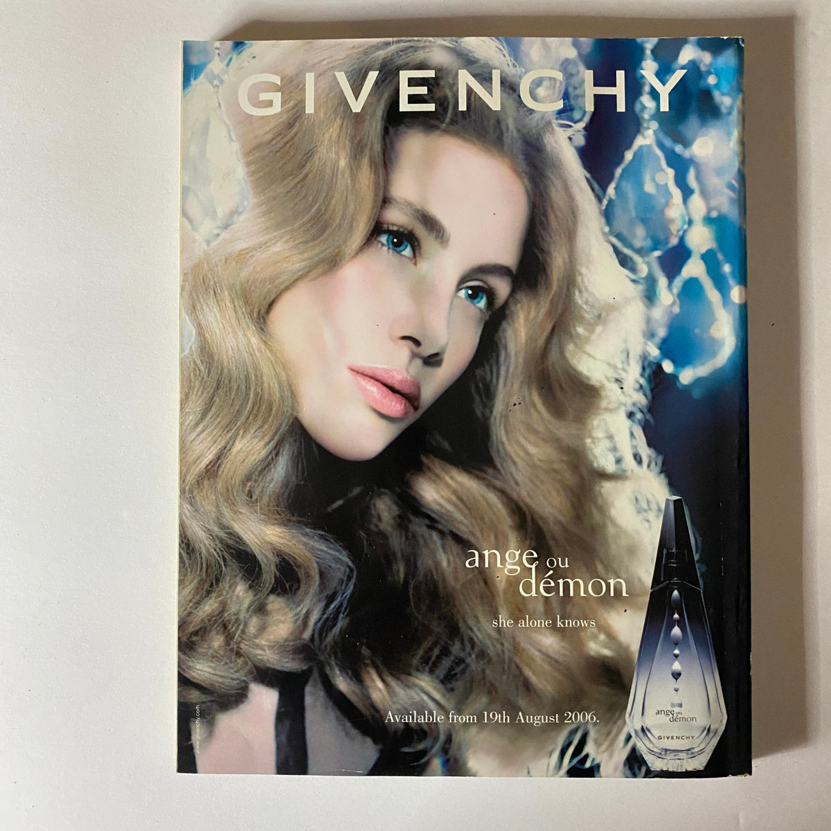 Promotional cover for Givenchy fragrance from August 2006, featuring a model with glamorous hair and makeup.