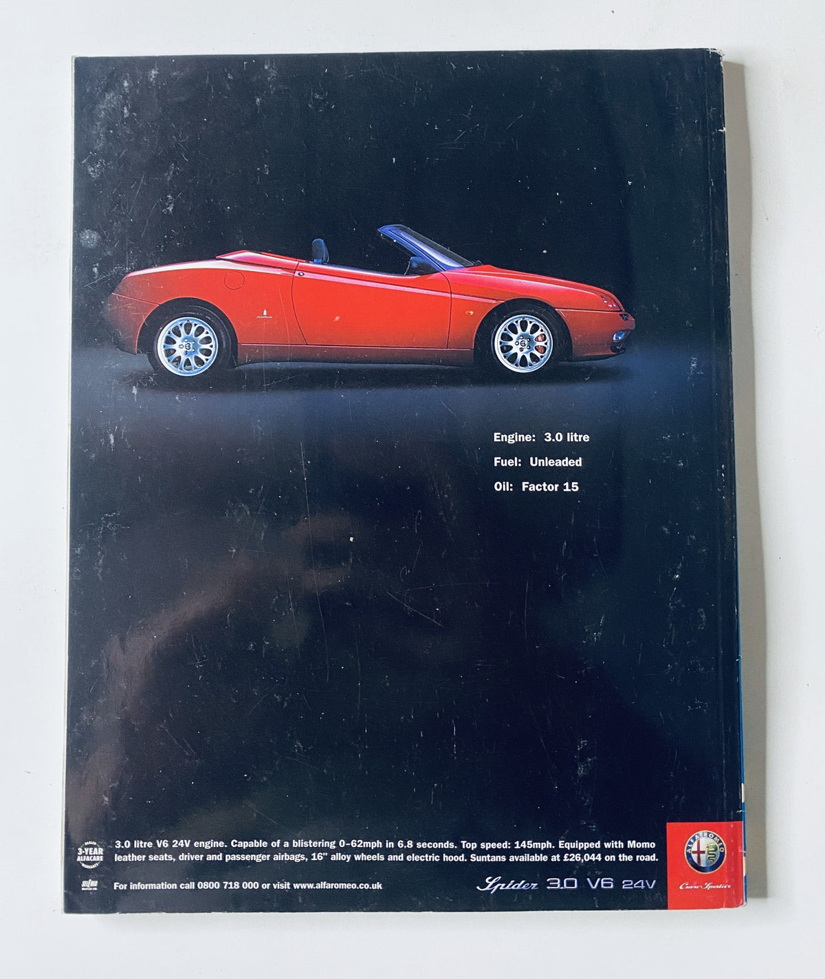 Cover of CAR Magazine May 2001 featuring articles on Aston Vanquish, Porsche 911 C4, New Mini, and MGF Trophy 160. The image highlights a striking red car against a dark background, emphasizing automotive design and engineering.