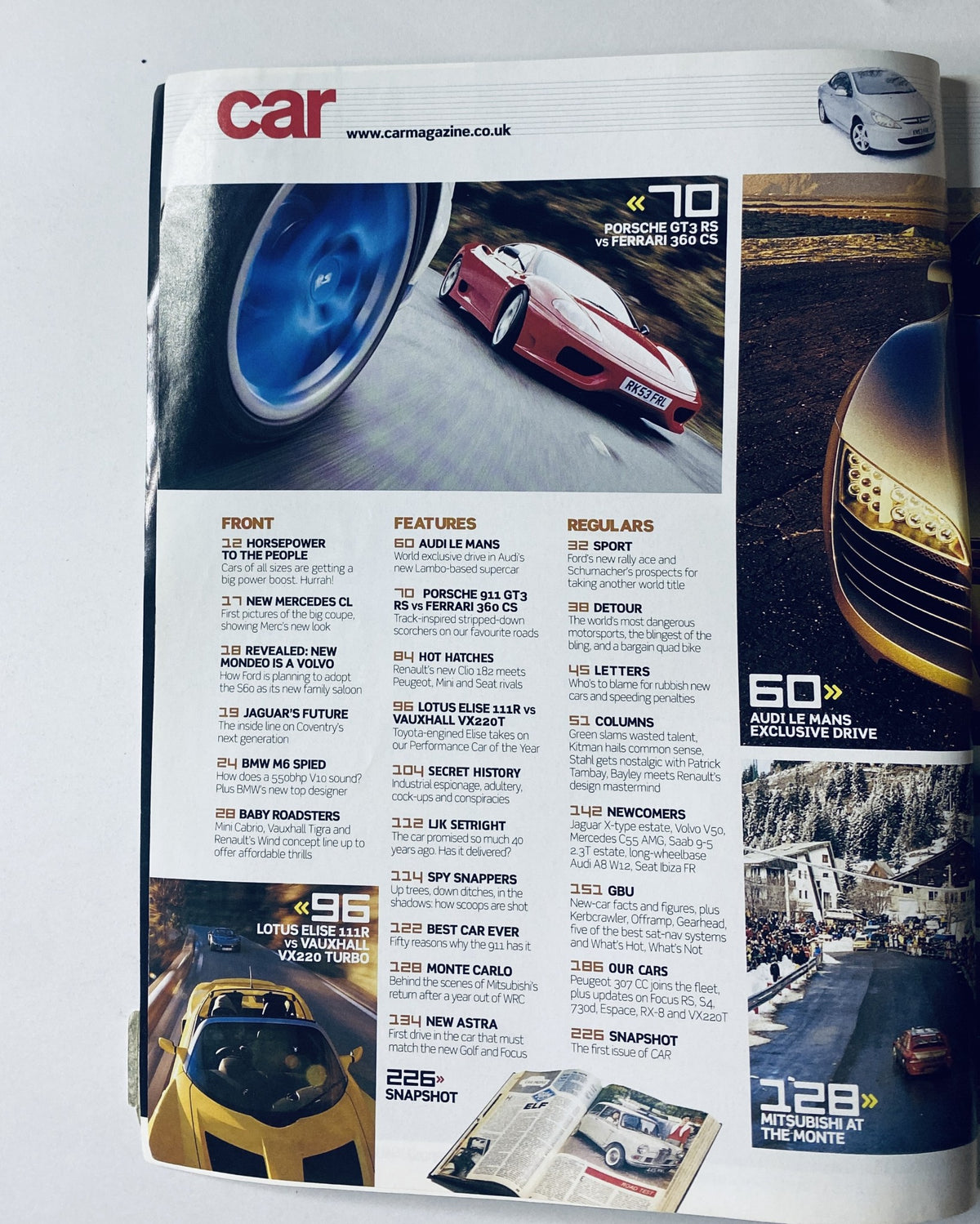 Table of contents page from CAR Magazine April 2004 detailing features and sections including Porsche, Ferrari, Audi Le Mans, and Lotus Elise.