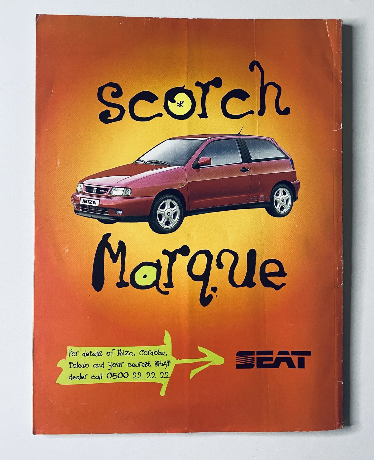 Advertisement for SEAT Ibiza titled 'Scorch Marque' from CAR Magazine December 1995, highlighting the car with a vibrant orange background.