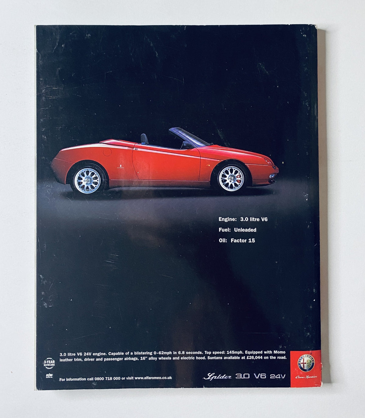 Car Magazine July 2001 back cover showcasing a red sports car with a 3.0 litre V6 engine. The cover highlights fuel specifications and oil recommendations.
