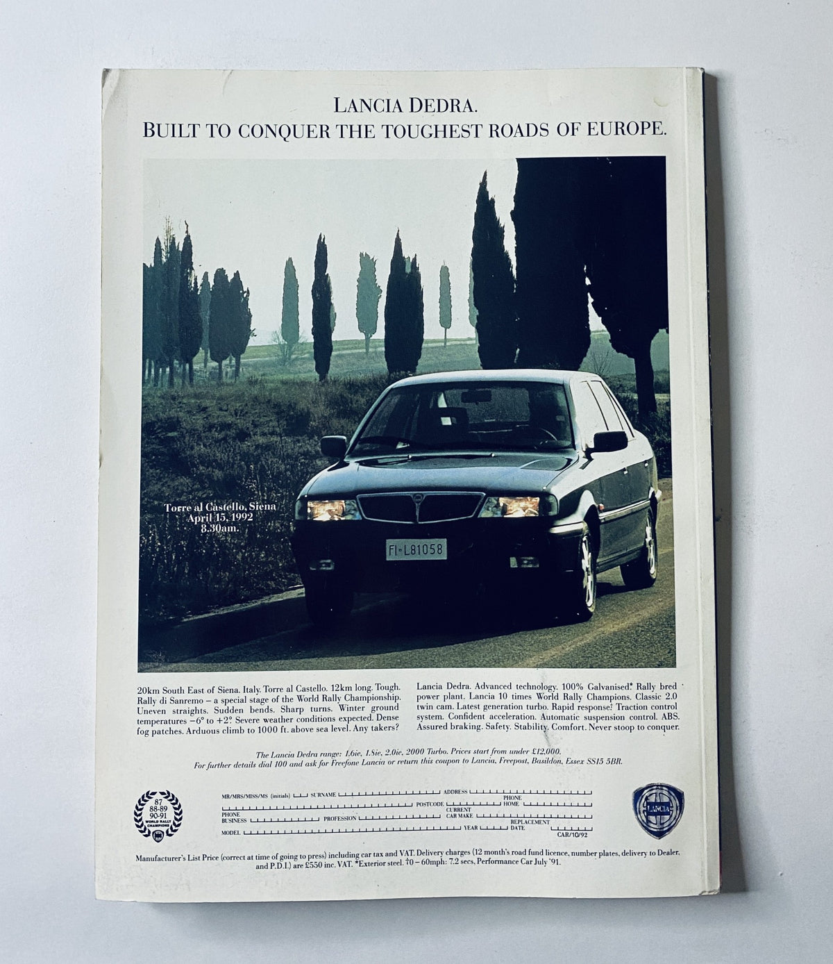 Back cover of Car Magazine October 1992 showcasing a Lancia Dedra advertisement, promoting its capability to conquer Europe's toughest roads.