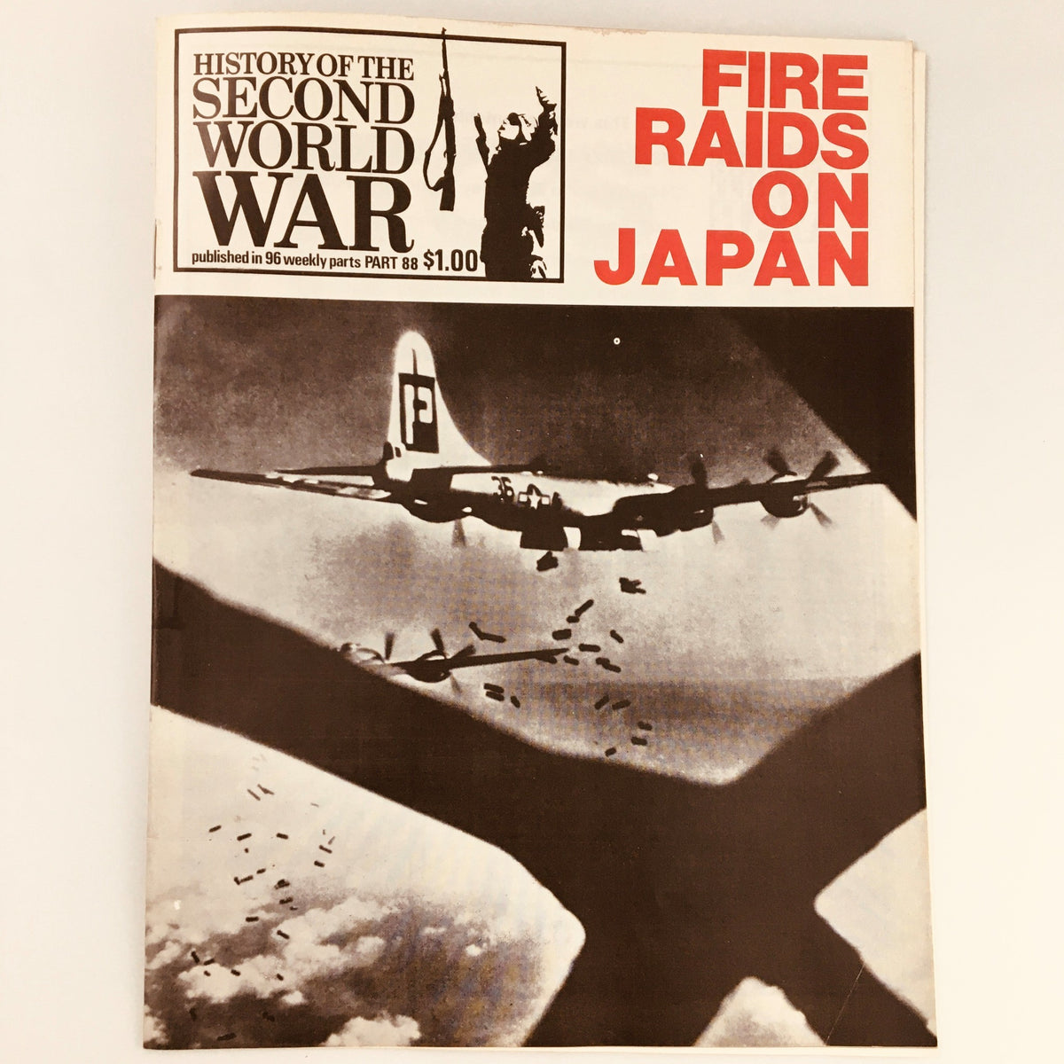 Vintage magazine cover of 'History of the Second World War Part 88: Fire Raids on Japan' featuring a B-29 bomber releasing bombs during World War II.