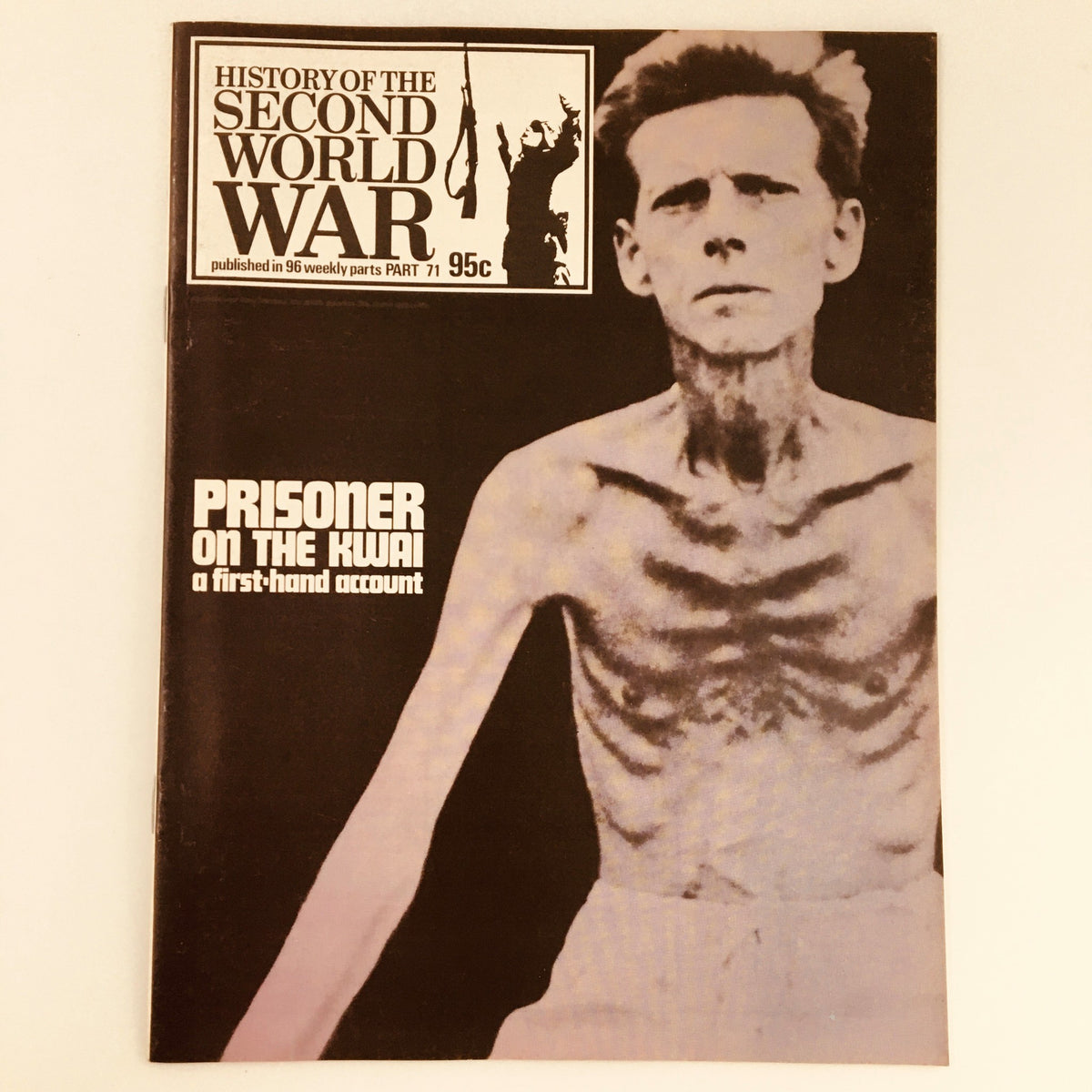 Cover of the vintage magazine titled 'Prisoner On The Kwai', part of 'History of the Second World War Part 71', showcasing a black and white photograph of a malnourished man, highlighting the harrowing experiences of prisoners of war during World War II.