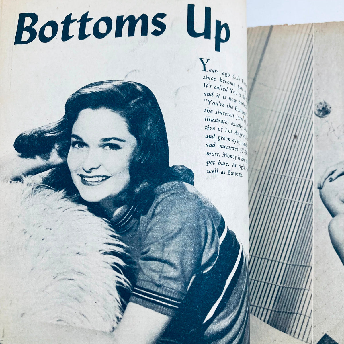 Feature page titled 'Bottoms Up' from VTG Cover Girls Models Magazine August 1954, displaying a smiling model.