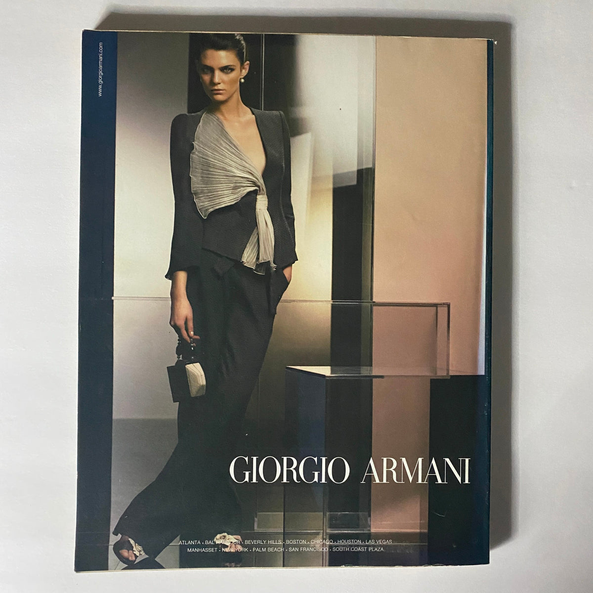 W Magazine February 2006 spread showcasing a chic Giorgio Armani outfit, highlighting luxurious fashion design and aesthetic appeal.