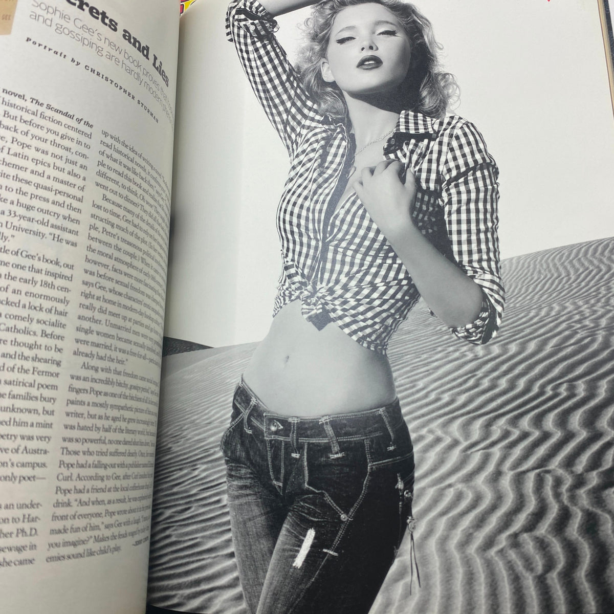 Fashion editorial page from W Magazine August 2007 featuring a model in a stylish checkered shirt and denim, epitomizing mid-2000s fashion.