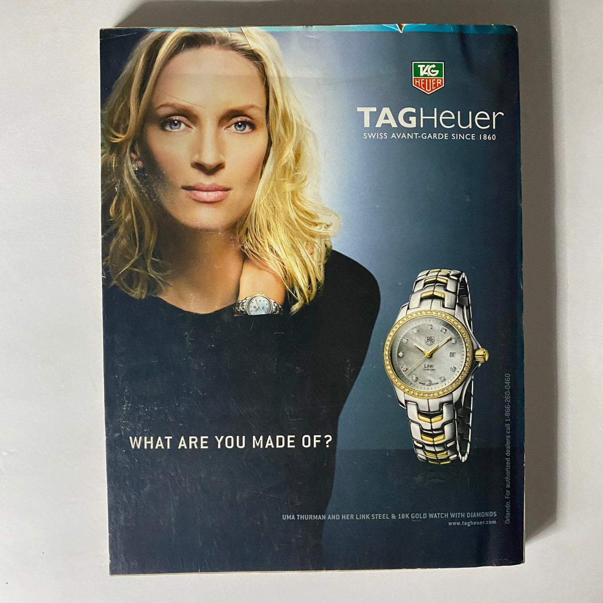 Advert featuring Uma Thurman for TAG Heuer watch in W Magazine November 2006. The ad captures a high-fashion aesthetic complementing the issue's luxurious themes.