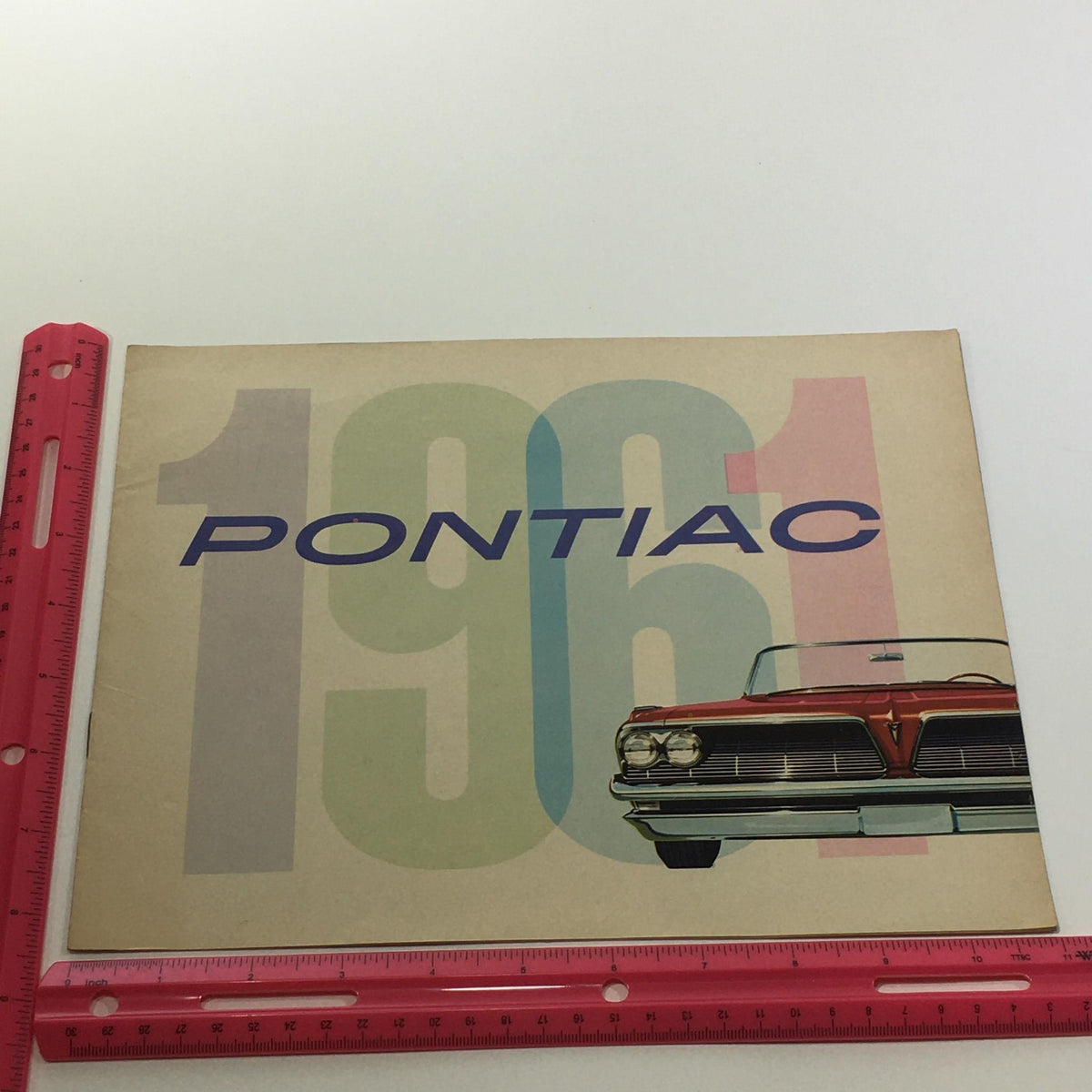 1961 Pontiac Trophy Economy V-8 Engine 303-Horsepower Car Sale Brochure cover featuring a bold design with the year '1961' prominently displayed.