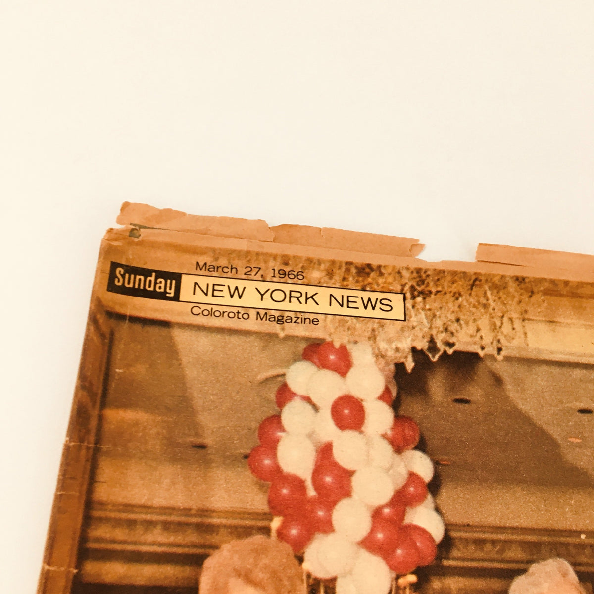 Close-up of the top of the Sunday New York News Magazine from March 27, 1966, showcasing the title and date, emphasizing its vintage character.
