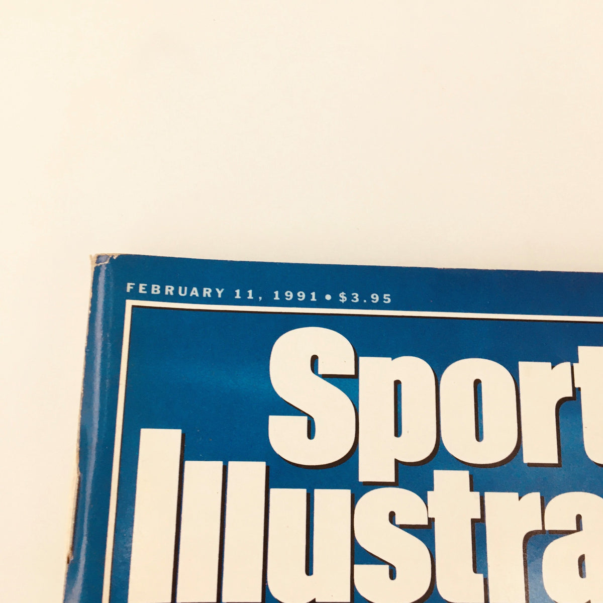 Top section of the Sports Illustrated Magazine February 11, 1991 displaying the publication date and price.