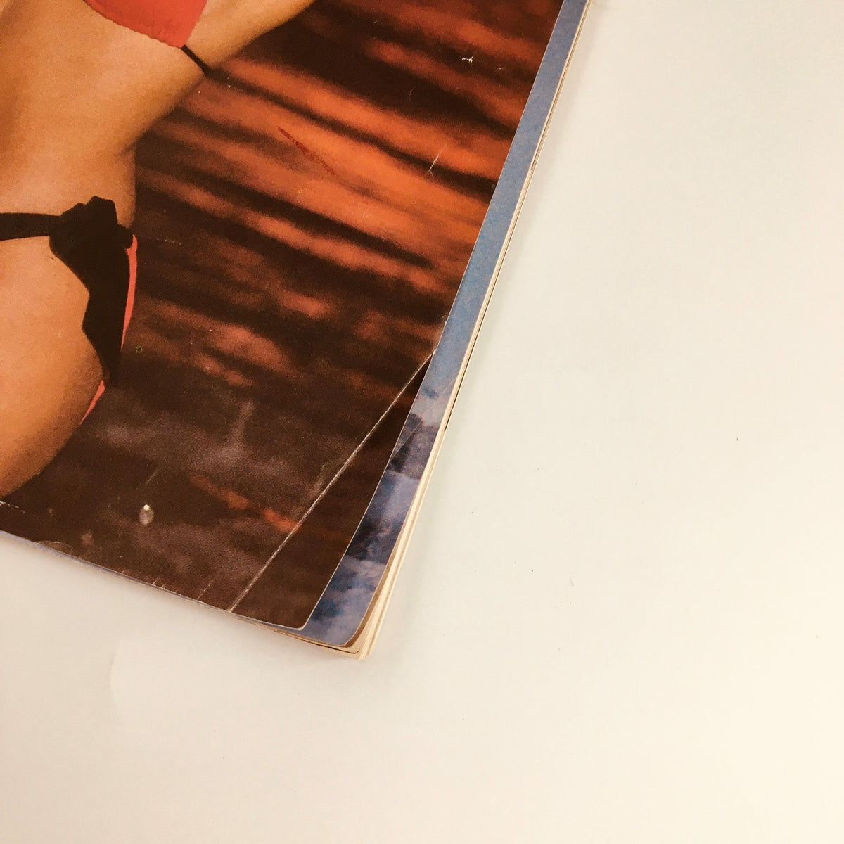 Close-up view of the corner of Inside Sports Magazine February 1987 featuring Miss USA Christy Fichtner on the cover, showcasing vintage magazine details and aesthetic character from the late 80s.