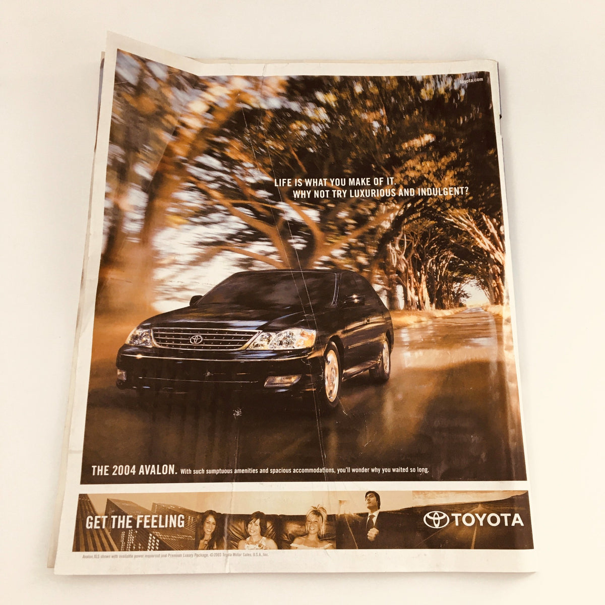 Toyota advertisement from The New York Times Magazine March 28, 2004, featuring the 2004 Avalon and highlighting its luxurious qualities.