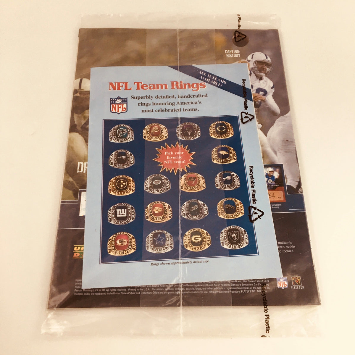Backside of Beckett Football Magazine July 2005 Vol #17 Issue 184 displaying a promotional page for NFL Team Rings, emphasizing sports collectibles alongside Randy Moss.