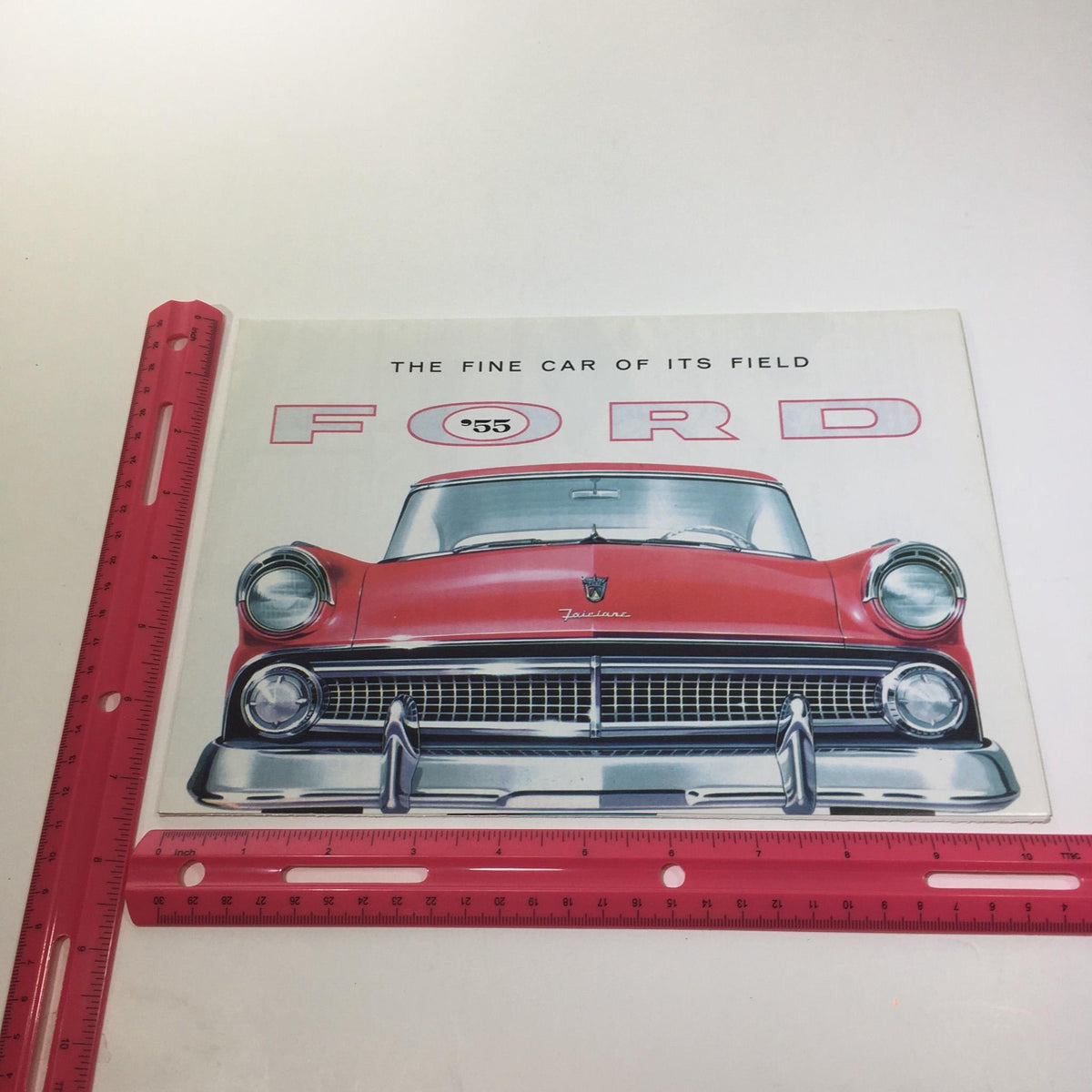 Cover of the 1955 Ford Trigger-Torque Power Angle-Poised V-8 Engines Car Catalog Brochure featuring a classic red Ford car illustration with the title 'The Fine Car of Its Field' and the year '55' prominently displayed.
