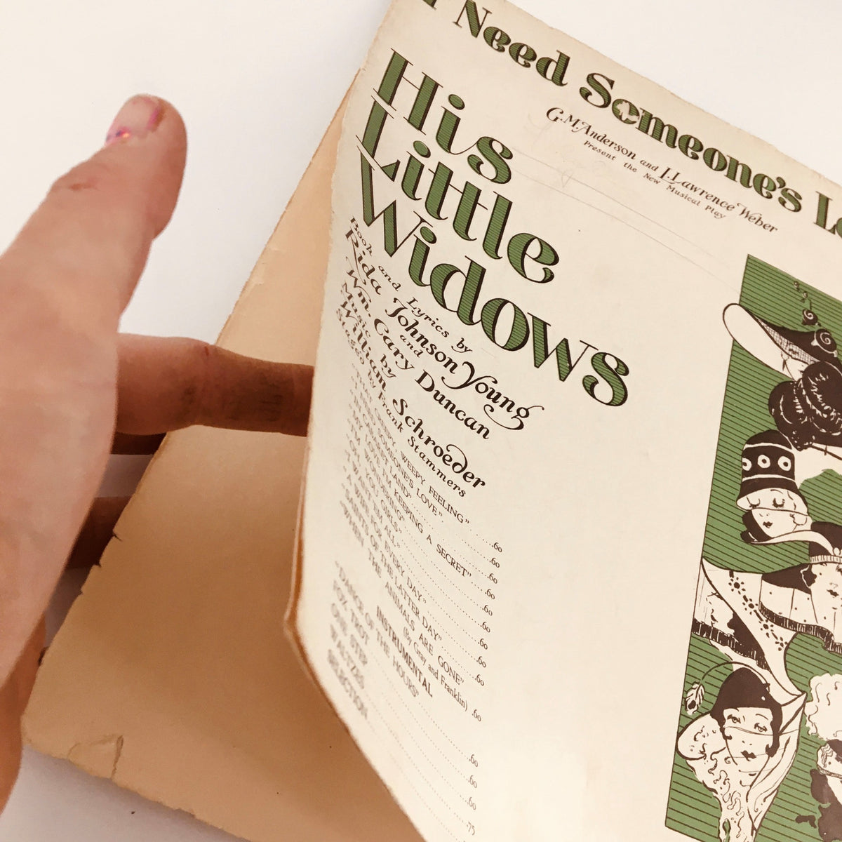 Side view of the vintage magazine 'I Need Someone's Love', titled 'His Little Widows', emphasizing the aged condition and binding of this historical music publication.