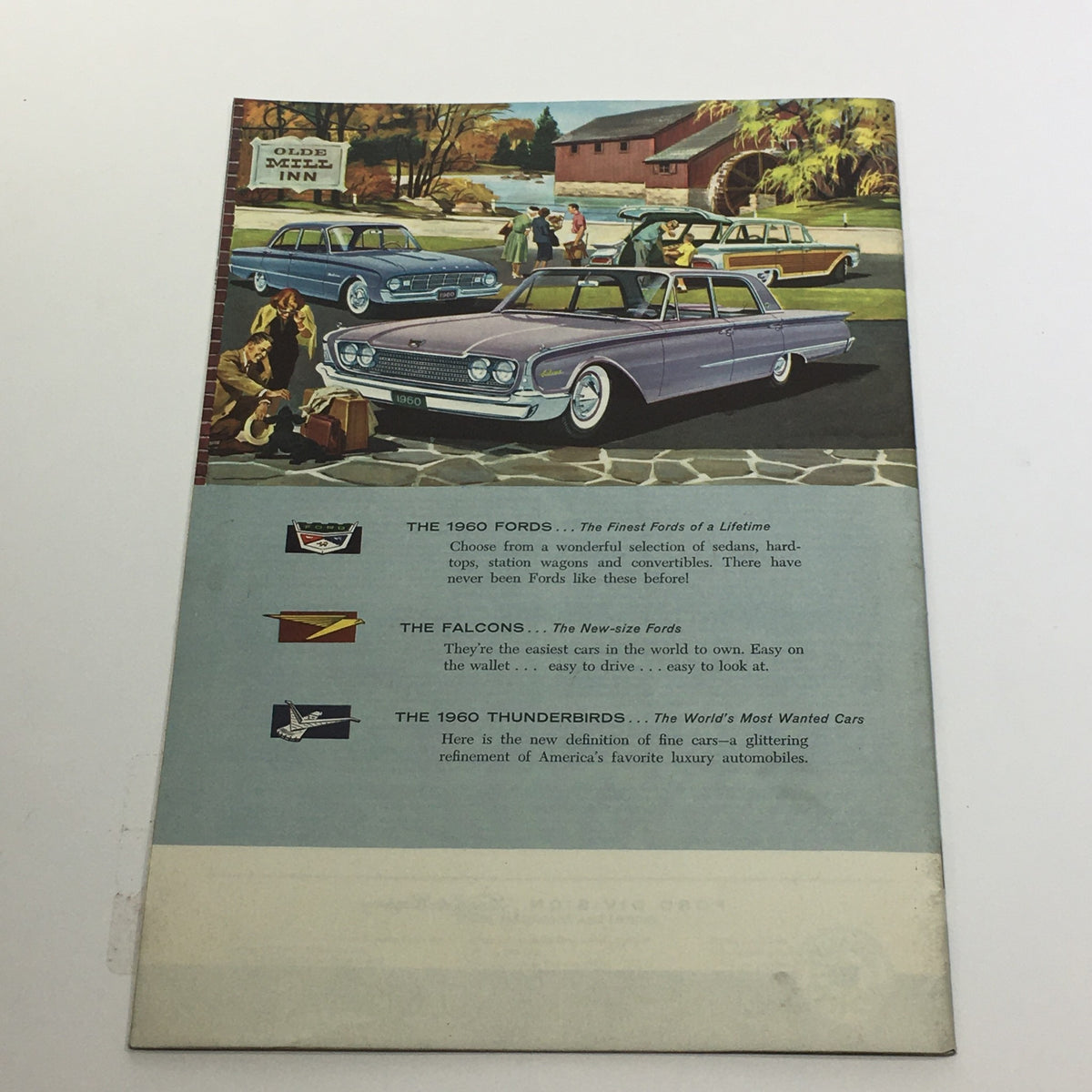 1960 Ford and Ford Wagons Galaxie Sedans Thunderbird 352 Special V8 Car Brochure displaying the rear side with an artistic depiction of the 1960 Ford models including the classic Falcon and Thunderbird.