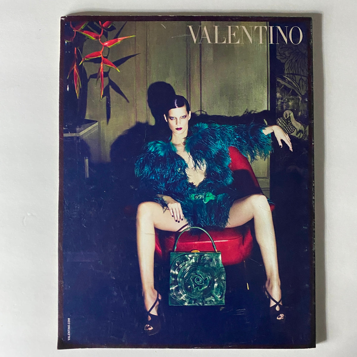 Cover of W Magazine July 2009 showcasing a striking fashion photography piece featuring a model in a luxurious outfit by Valentino, embodying vintage Hollywood glamour.
