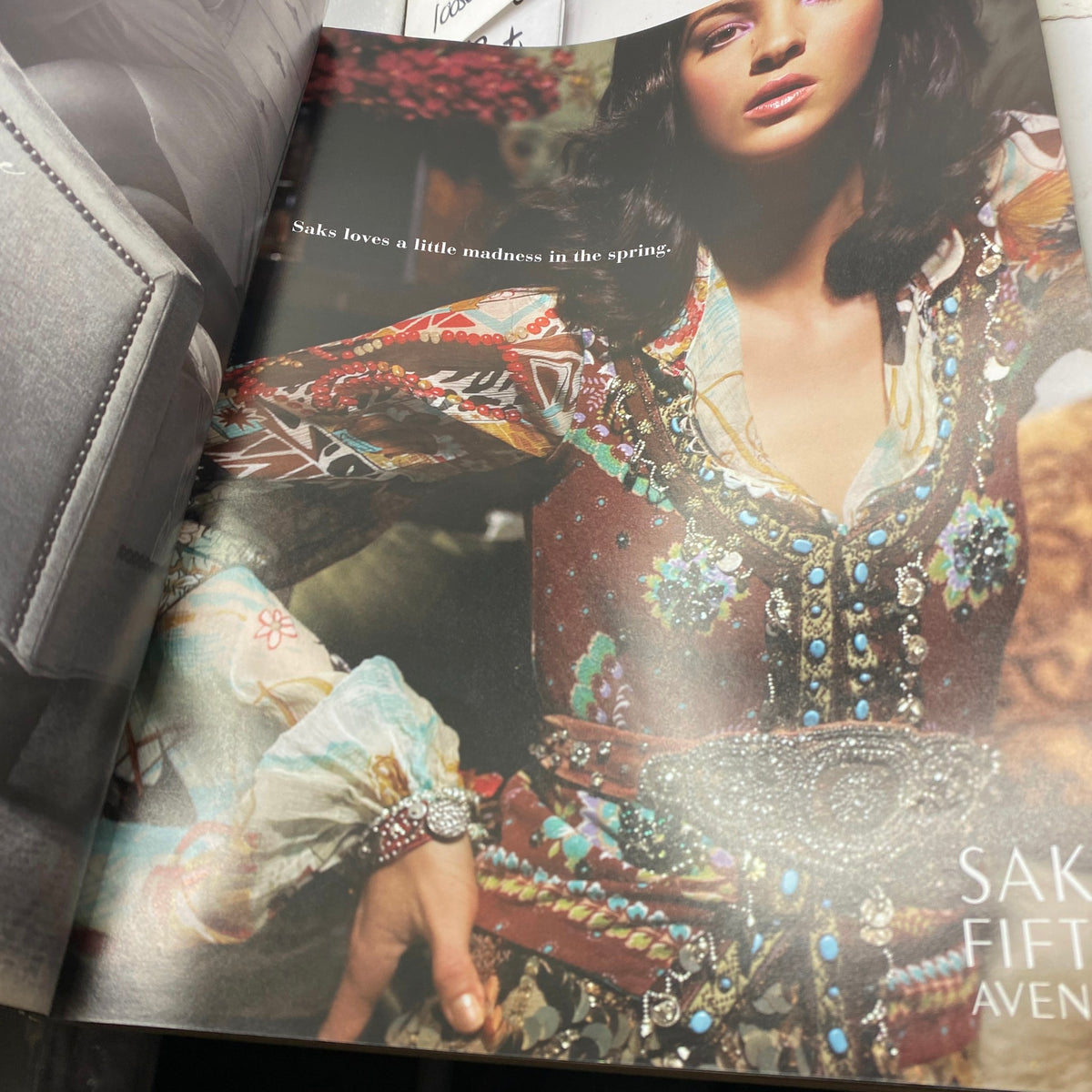 Feature from W Magazine March 2005 with model showcasing a colorful spring outfit, capturing the essence of fashion and style. Original vintage magazine featuring Kate Moss on the cover.
