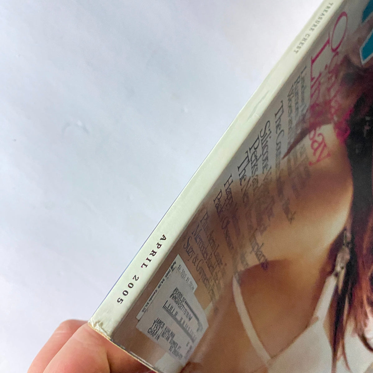 Side view of W Magazine April 2005 showcasing its publication date and condition, focusing on vintage magazine details.