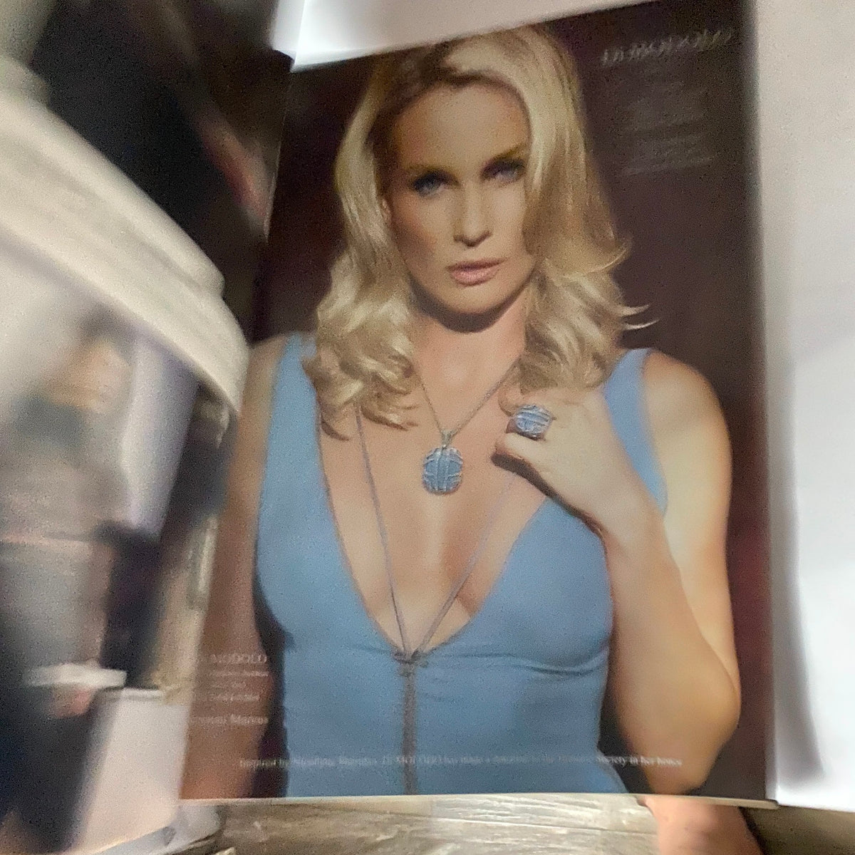 W Magazine May 2005 features a stunning close-up of a glamorous model showcasing a deep V-neck dress, exuding elegance and style from the early 2000s.
