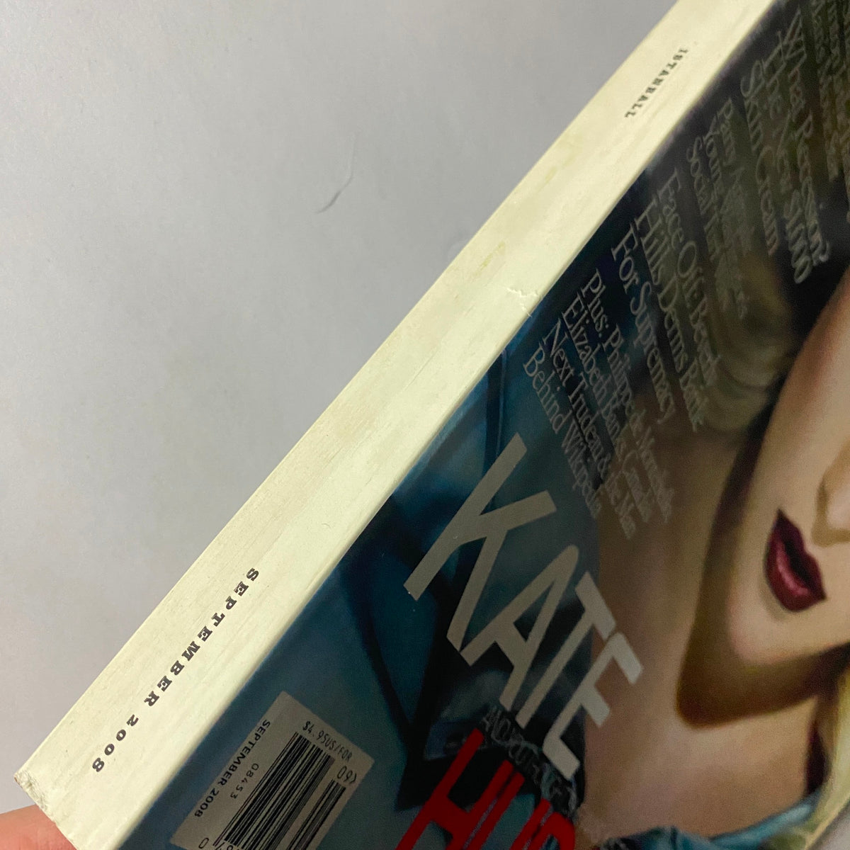 Side view of W Magazine September 2008 issue featuring actress Kate Hudson, highlighting the vintage condition and spine details of this collectible magazine.