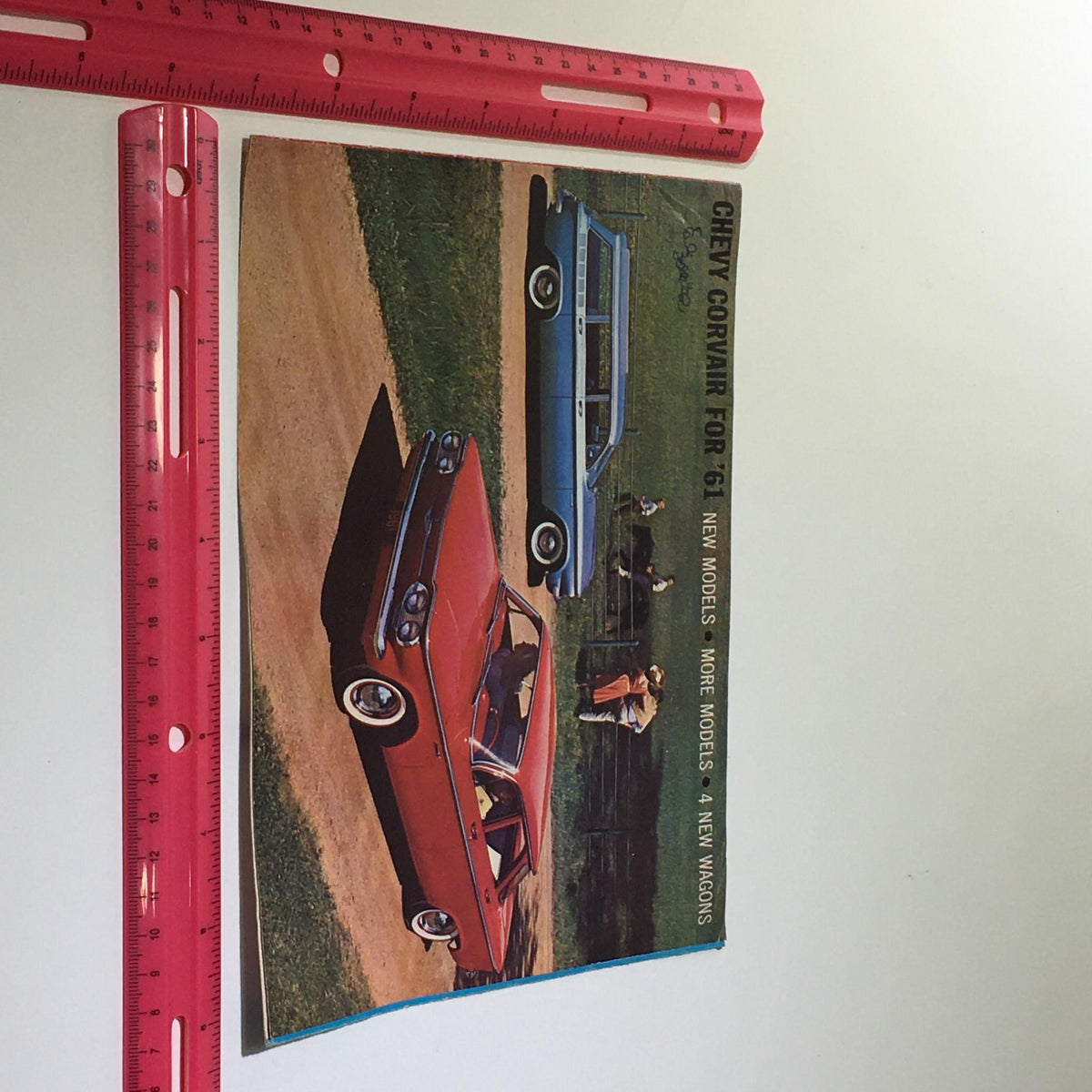 1961 Chevy Corvair 500 4-Door Sedan catalog cover featuring exterior views of multiple models in a scenic setting.