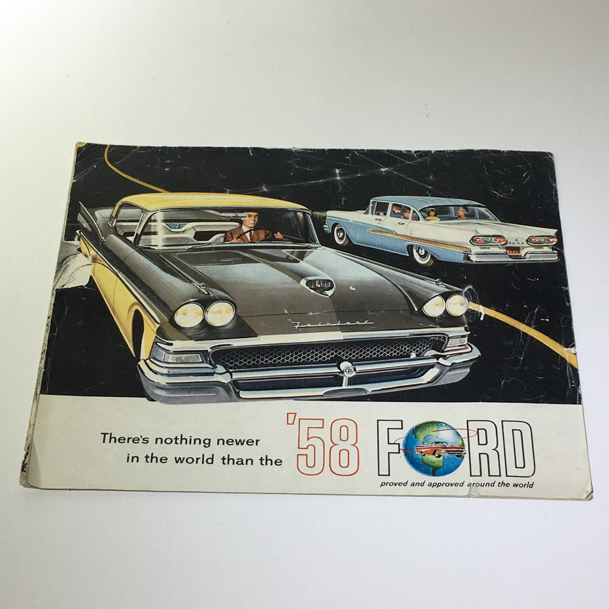 Cover image of the 1958 Ford Thunderbird & Skyliner Wagon Series V-8 Engine Car Catalog Brochure showcasing classic cars on a scenic road.