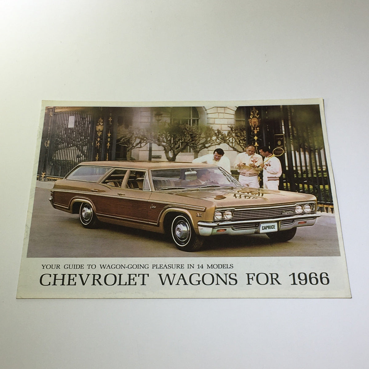 1966 Chevrolet Wagon-Going Caprice 4-Door 2-Seat Wagon Car Catalog Brochure showing a Chevrolet wagon on display with a presentation backdrop.
