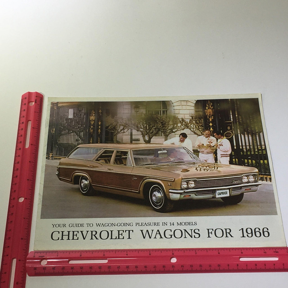 1966 Chevrolet Wagon-Going Caprice 4-Door 2-Seat Wagon Car Catalog Brochure showcasing the Caprice with a vintage background and measurements for display.