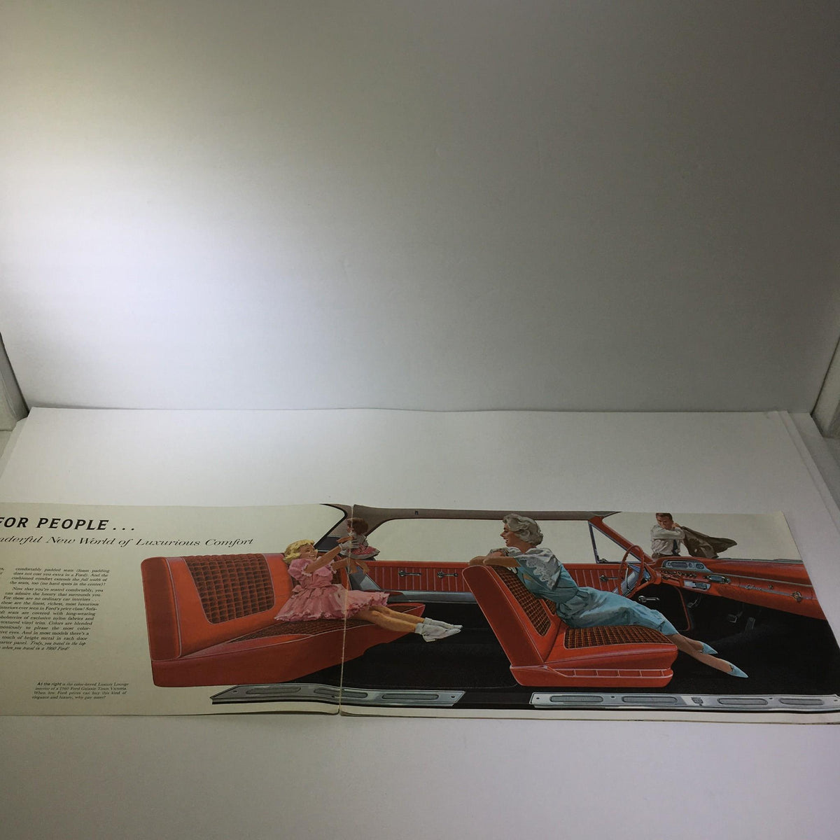 Interior page of the 1960 Ford Galaxies-Fairlanes-Starliner-Sunliner V-8 Engine Car Catalog Brochure, displaying colorful illustrations of a luxurious car interior with people enjoying comfort.