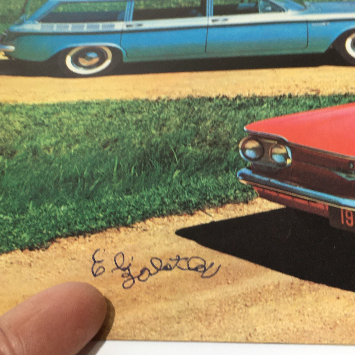 Close-up of the signature on the 1961 Chevy Corvair 4 New Wagons Lakewood 700 Catalog, showcasing the artistry of the brochure's design.