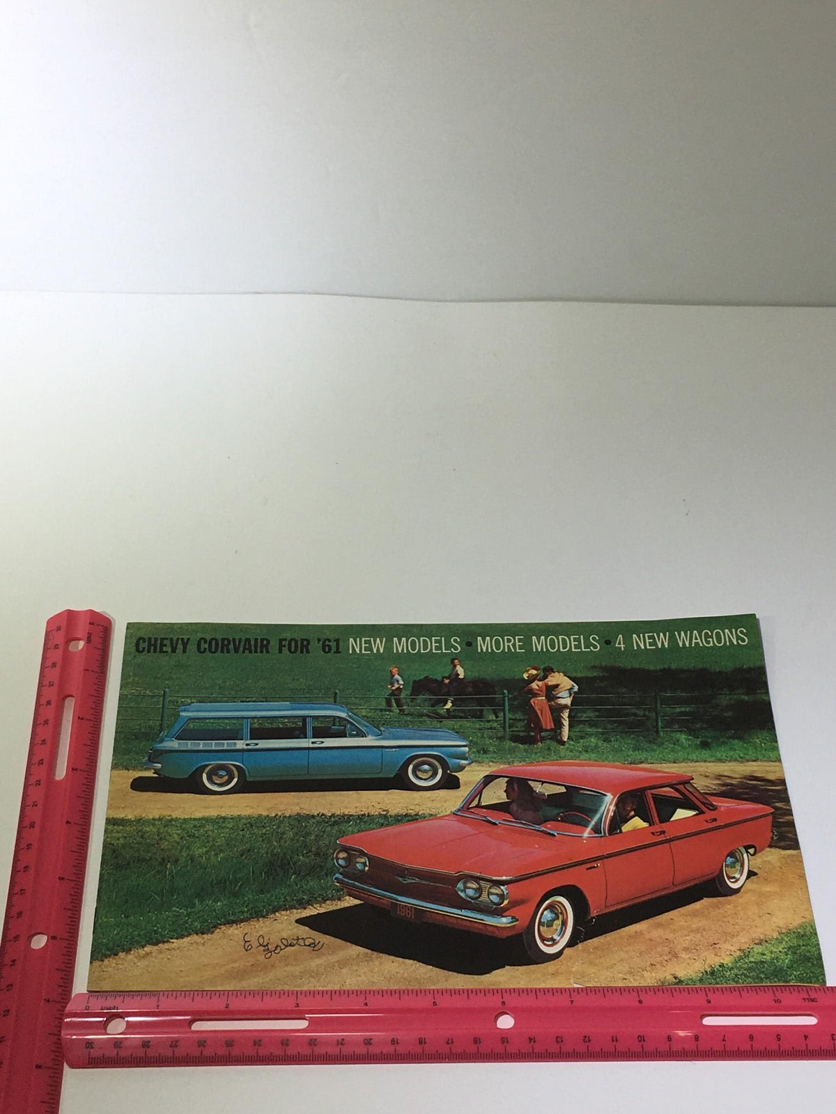 Front cover of the 1961 Chevy Corvair 4 New Wagons Lakewood 700 brochure, featuring vibrant graphics and vintage automotive design.