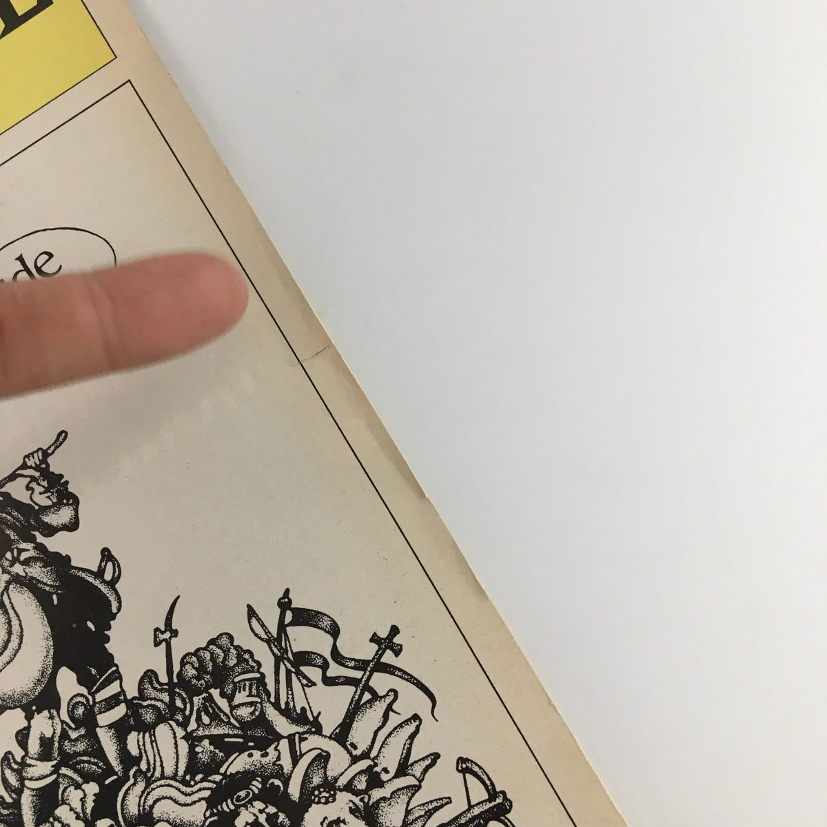 Detailed image of the side edge of the 1975 Playbill for The Broadway Theatre 'Candide', highlighting slight imperfections.
