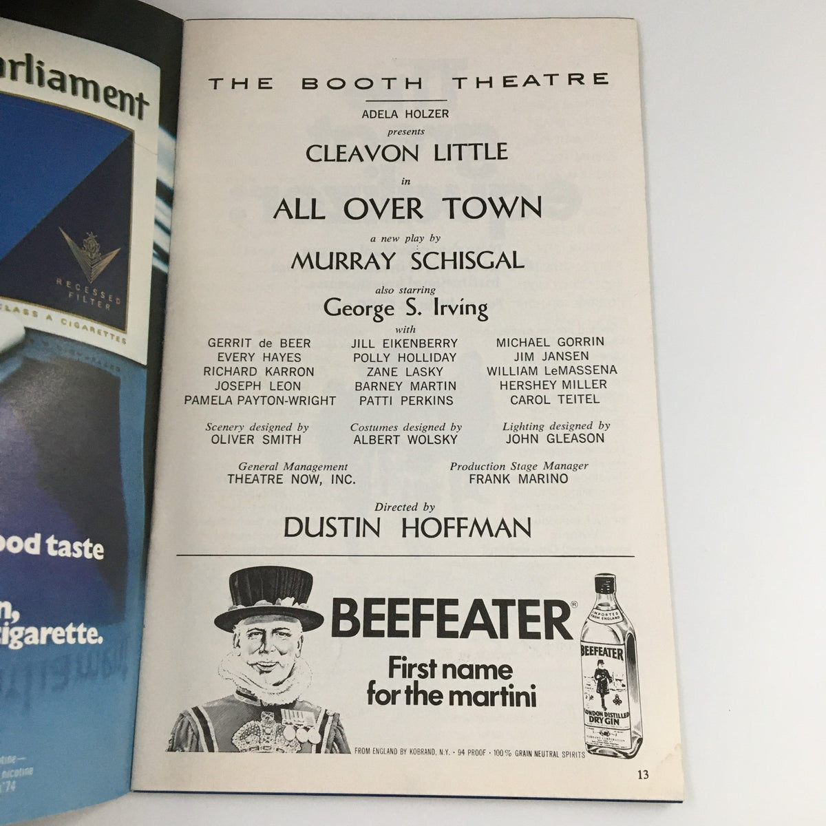 Interior page of the 1975 Playbill for 'All Over Town' at The Booth Theatre, featuring cast list and credits, highlighting George S. Irving.