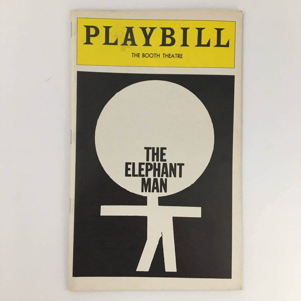 1979 Playbill for The Elephant Man at Booth Theatre featuring a minimalist design with a large circle and a stick figure, showcasing the iconic production.