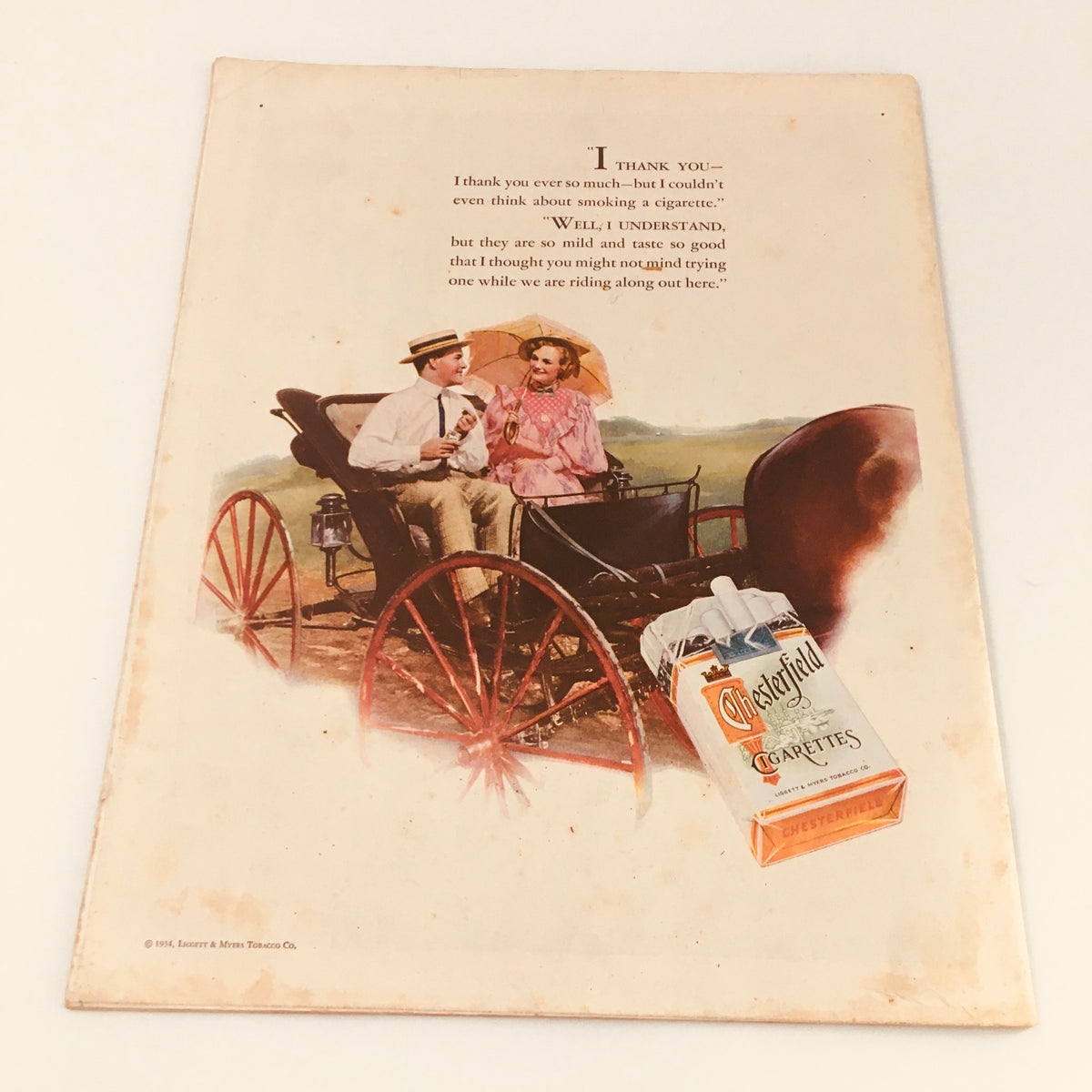 Vintage advertisement featuring a couple in a horse-drawn carriage discussing Chesterfield cigarettes. This image accompanies the article 'Who Rules Germany' from the VTG Collier's Magazine September 15 1934.