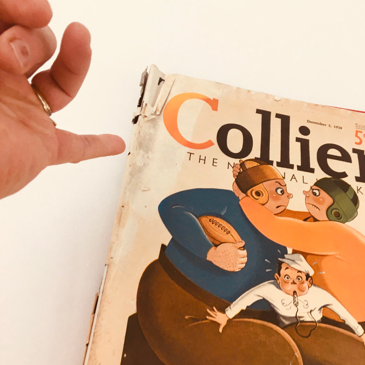 Vintage Collier's Magazine from December 3, 1938, displaying the cover with two football players in a playful confrontation and highlighting the title. Perfect for collectors and literary enthusiasts.