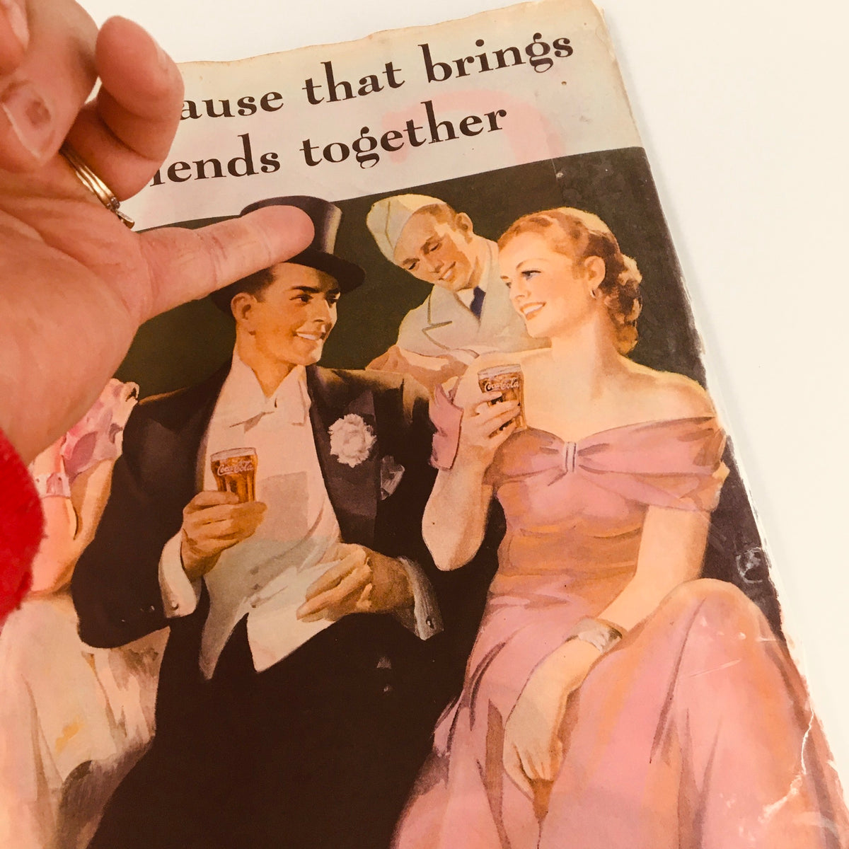 Close-up of the Coca-Cola advertisement from the vintage Collier's Magazine, illustrating social gathering with friends, enhancing the nostalgic context of 'The Dance Shanghai Love Story' by Pearl Buck.